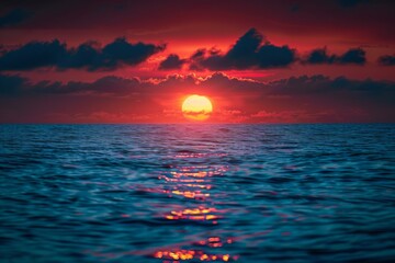 Wall Mural - Ocean sunset with vibrant orange sun