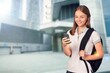 © BillionPhotos.com - Young woman texting on smartphone at street