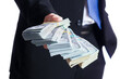 © Kostia - A money in the hands of a businessman in a crisis raising business concept bank worker