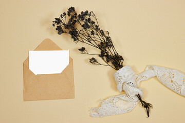 Wall Mural - craft envelope with white card and gypsophila bouquet and white lace