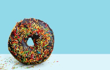 Wall Mural - Creative Colourful glazed sweet doughnut with sprinkles