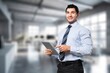 © BillionPhotos.com - Happy young business man  in office.