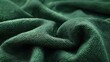 © Justlight - A tight crop of a deep green flannelette cloth showcasing the texture and thickness of its woven fibers