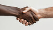 © AstraNova - close-up Two hands shaking one hand is a white man's hand and the other hand is a black man isolated on a white background