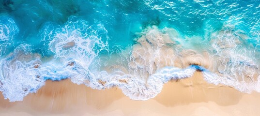 Wall Mural - Beautiful top view of the sea and sandy beach with blue water, waves and foam from above. summer background for banner or poster design