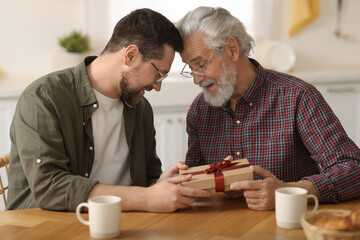 Sticker - Son giving gift box to his dad at home