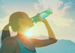 © kieferpix - Active fit person drinking water after workout