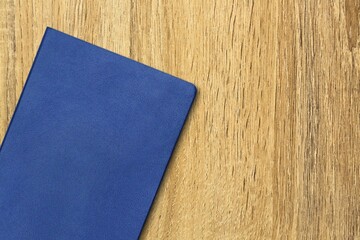 Wall Mural - Blue leather office notebook on the desk