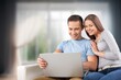 © BillionPhotos.com - Happy man and woman relax with computer at home