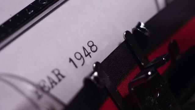 Year 1948, Typing on White Paper in Vintage Typewriter, Macro Close Up