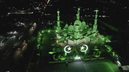 Wall Mural - Establish aerial view of the Baiturrahmah Mosque at night in the city of Padang, West Sumatra. d-log raw stock video