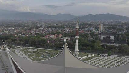 Wall Mural - Establish aerial view of Grand Mosque, one of the largest mosques in Indonesia, is located in the city of Padang, West Sumatra .d-log raw stock video