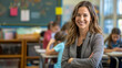© VISUAL BACKGROUND - A smiling teacher in a classroom.