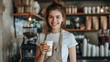 © PatternHousePk - Carefree Female Barista Holding a Customer's Order