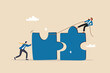 © Nuthawut - Jigsaw puzzle connection, teamwork partnership to help solve problem or challenge, cooperation or brainstorm to fit and match jigsaw pieces concept, businessman and woman help connect jigsaw puzzle.