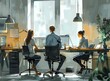 © Molang Visual - Three People Working at a Desk in an Office