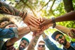 © MADNI - Community of people stacking hands together, Peoples putting their hands on top of each other social, community and team building concept