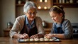© Hashim - Girl and grandmother bake cookies, creating cherished memories of learning and bonding