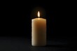 © Adam - Burning candle in the dark. Warm candlelight providing light and heat in the darkness.