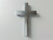 © Brian Carter - A modern minimalist religious cross showcased against a plain white background, epitomizing simplicity and elegance