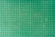 © thongchainak - Background and textured of cutting mat green color. Used paper cutting mat.