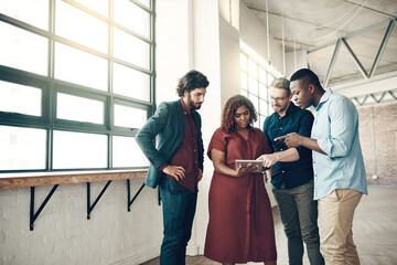 Wall Mural - Business people, teamwork and meeting with tablet for collaboration or discussion on startup together at office. Group of young creative employees working on technology for innovation at workplace