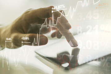 Poster - Abstract creative financial graph with finger clicks on a digital tablet on background, financial and trading concept. Multiexposure