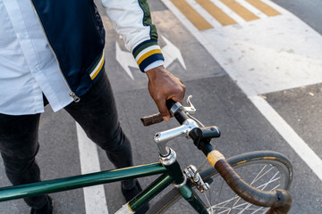 Wall Mural - Close-up of casual businessman with bicycle in the city