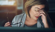 © peopleimages.com - Glasses, headache and stress with business woman in office at night for compliance or deadline. Burnout, eye strain and tired with professional employee in workplace for evening problem solving