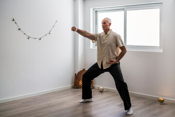 Man practicing martial arts in gym