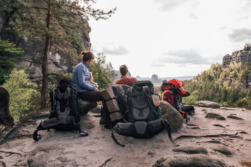 Germany, Saxony, Elbe Sandstone Mountains, friends on a hiking trip having a break