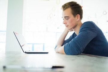 Poster - Worried student looking at laptop