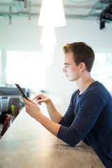 Poster - Young man using tablet