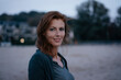 © tunedin - Germany, Hamburg, portrait of smiling redheaded woman