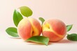 © juliars - Two juicy peaches with vibrant green leaves on a soft pink background