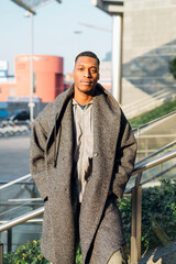 Wall Mural - Portrait of fashionable young man in the city