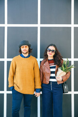 Wall Mural - Portrait of young couple hand in hand