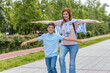 © Panorama - Mom and son skate and keep their balance