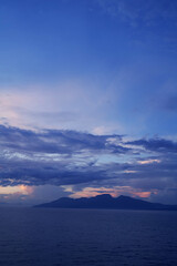 Wall Mural - A mountain view from the middle of the sea in the early morning