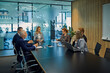 © tunedin - Group of business people discussing in meeting