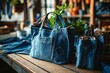 © Mountain Fairy - Handbags, shopping bags made from old jeans on a dressmaker table. DIY, denim upcycling, using old jeans, upcycle denim stuff. Sustainable lifestyle, hobby, crafting, recycling, waste, Generative AI