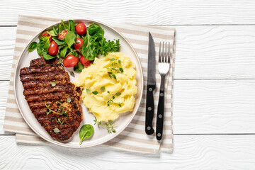 Sticker - grilled pork steak with mashed potato and salad