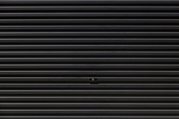 Canvas Print - A black shutter door background and texture.