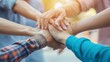 © Jelena - teamwork and collaboration concept with corporate professionals joining hands reinforcing unity and collective success
