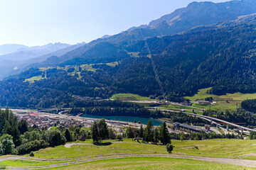 Wall Mural - Scenic aerial view of mountain village Airolo with Leventina Valley in the Swiss Alps on a sunny late summer day. Photo taken September 10th, 2023, Gotthard, Canton Ticino, Switzerland.