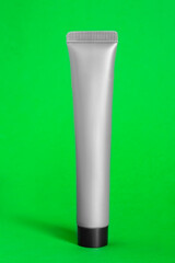 Poster - Tube on green background