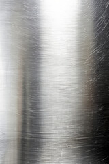 Poster - close-up of a brushed metal surface with scratches and texture, showcasing an industrial aesthetic a