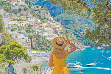 Vacation in Italy. Woman tourist enjoying vacation sun and views. Inspiration Positano, Amalfi coast