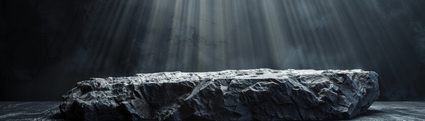 Poster - Dramatic graph of a rough stone slab illuminated by ethereal rays of sunlight in a dark, moody environment, evoking mystery and depth.
