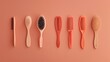 © Mujtaba Zeeshan - A travel-sized hair comb and brush set, arranged against a solid peach background, showcasing their compact design and portability for grooming on the go.